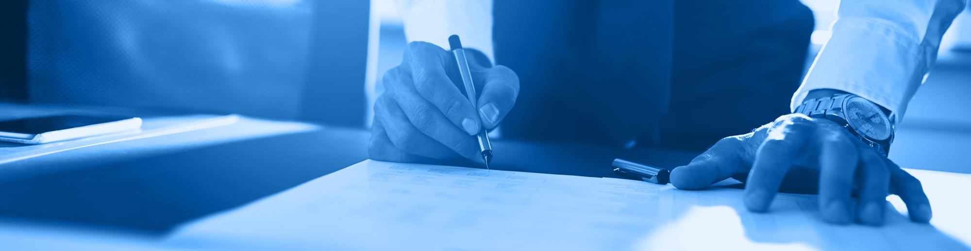 stock image professional signing document, hands pen and paper, all washed in monochromatic blue from the main logo